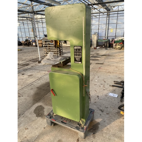 36 - AN INDUSTRIAL STARTRITE SINGLE PHASE BANDSAW COMPLETE WITH A SPARE BLADE AND FOUR WHEELED TROLLEY FO... 