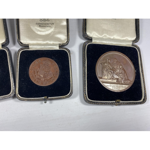 92 - A GROUP OF FOUR VINTAGE CASED BRONZE MEDALS