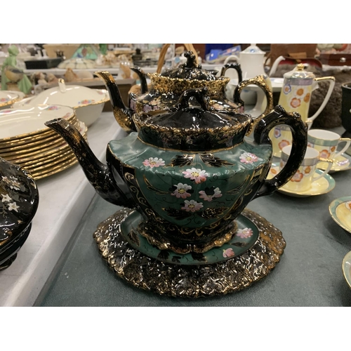 445 - FOUR VICTORIAN JACKFIELD TEAPOTS AND TRIVET STANDS