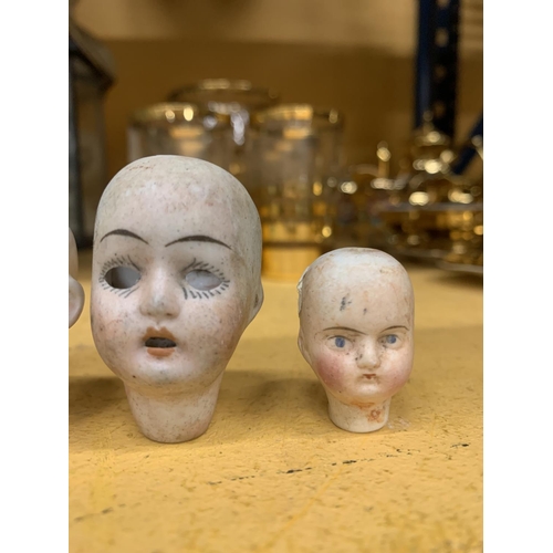 851 - FOUR VINTAGE BISQUE DOLLS HEADS TO INCLUDE ONE MARKED GERMANY WITH THE NUMBER 395 A.100 M, A CEUS, G... 