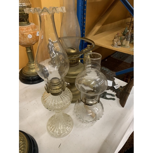 883 - THREE VINTAGE OIL LAMPS, ONE BRASS AND TWO GLASS