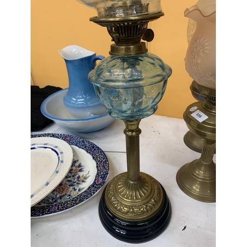 885 - A VICTORIAN OIL LAMP WITH BRASS STEM, BLUE GLASS MIDDLE, A GLASS ENGRAVED SHADE AND A CHIMNEY HEIGHT... 