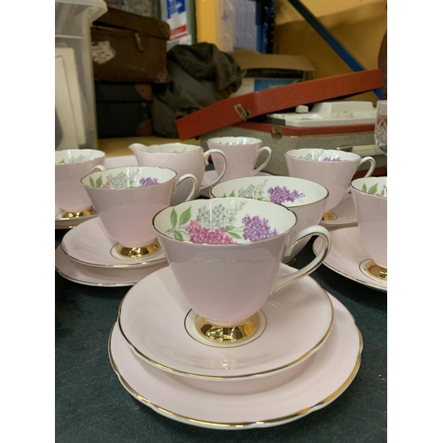 894 - AN OLD ROYAL BONE CHINA TEASET IN PALE PINK WITH FLORAL DECORATION TO INCLUDE A CAKE PLATE, CREAM JU... 