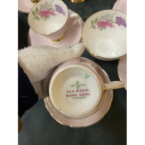 894 - AN OLD ROYAL BONE CHINA TEASET IN PALE PINK WITH FLORAL DECORATION TO INCLUDE A CAKE PLATE, CREAM JU... 