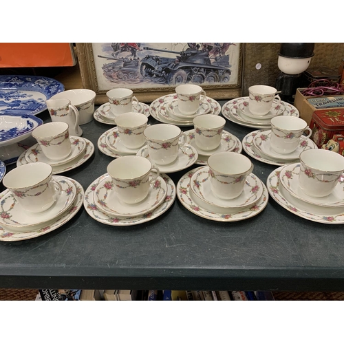 898 - A VINTAGE ENGLISH CHINA LARGE QUANTITY OF TEAWARE TO INCLUDE CUPS, SAUCERS, SIDE PLATES, CREAM JUG A... 