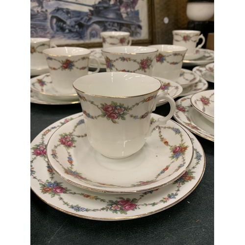 898 - A VINTAGE ENGLISH CHINA LARGE QUANTITY OF TEAWARE TO INCLUDE CUPS, SAUCERS, SIDE PLATES, CREAM JUG A... 