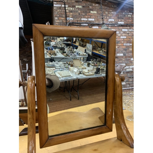 912 - AN OAK FRAMED DRESSING TABLE MIRROR