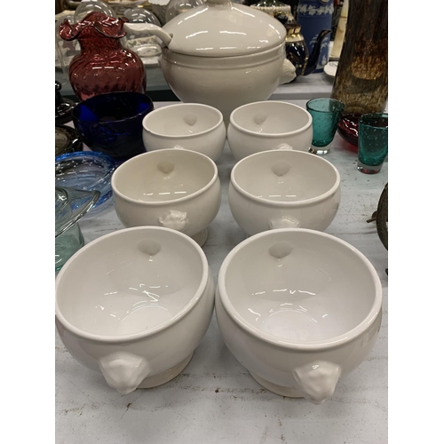 931 - A WHITE CERAMIC SOUP SET TO INCLUDE A SOUP TUREEN WITH LADEL AND SIX SOUP BOWLS