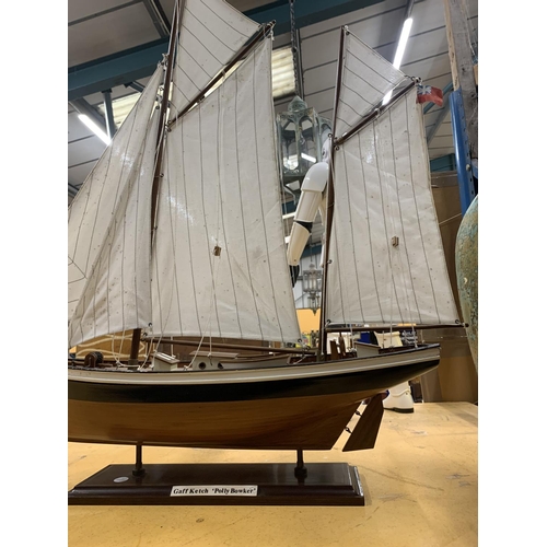 947 - A WOODEN MODEL OF A SAILING BOAT CALLED 'POLLY BOWKER' LENGTH 68CM