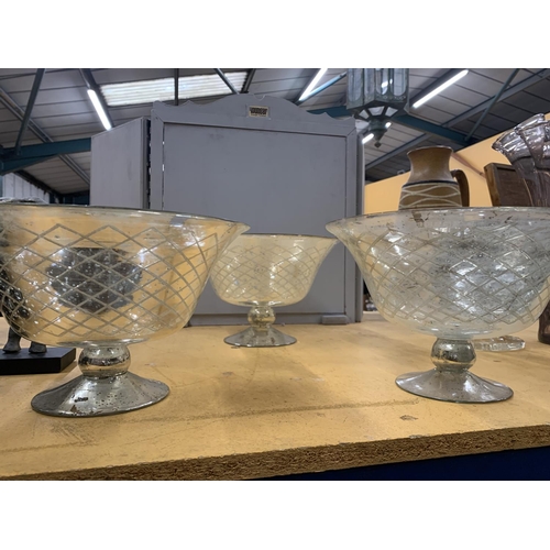 949 - THREE LARGE GLASS FOOTED BOWLS