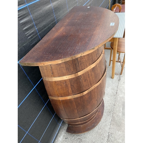 2740 - AN OAK BAR MADE FROM A HALF BARREL WITH COPPER BANDING 32