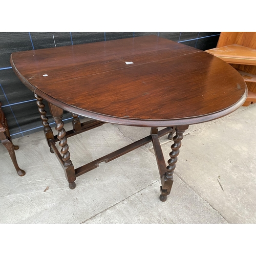 2744 - AN EARLY 20TH CENTURY OAK GATE LEG DINING TABLE ON BARLEY TWIST LEGS