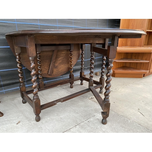 2744 - AN EARLY 20TH CENTURY OAK GATE LEG DINING TABLE ON BARLEY TWIST LEGS