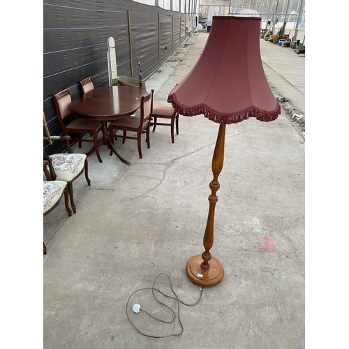 2749 - A BEECH STANDARD LAMP COMPLETE WITH BURGUNDY SHADE