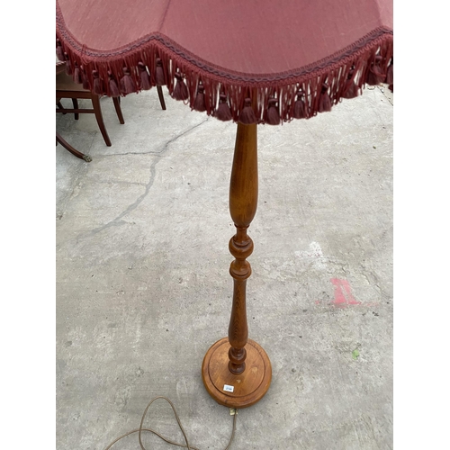 2749 - A BEECH STANDARD LAMP COMPLETE WITH BURGUNDY SHADE