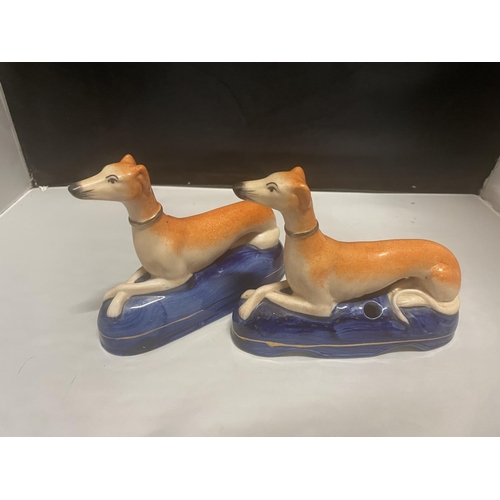 95 - A PAIR OF ANTIQUE STAFFORDSHIRE GREYHOUND INK WELLS