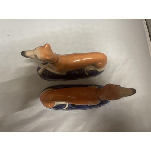 95 - A PAIR OF ANTIQUE STAFFORDSHIRE GREYHOUND INK WELLS