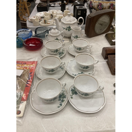 158 - A FIESTA TEASET TO INCLUDE A TEAPOT, SUGAR BOWL, CREAM JUG, SIX CUPS AND SAUCERS