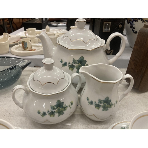 158 - A FIESTA TEASET TO INCLUDE A TEAPOT, SUGAR BOWL, CREAM JUG, SIX CUPS AND SAUCERS