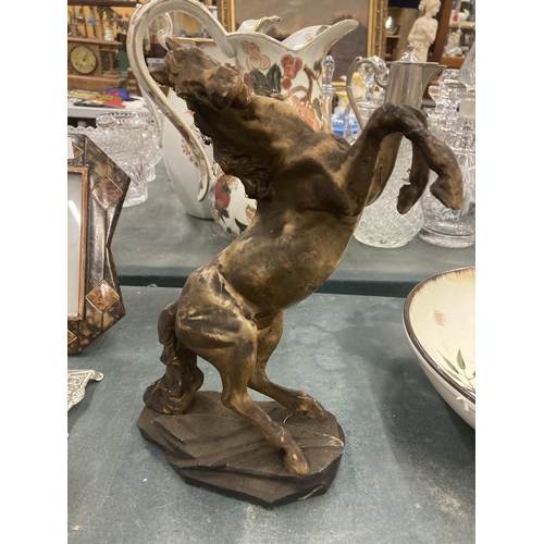 192 - A RESIN MODEL OF A REARING STALLION HEIGHT 30CM