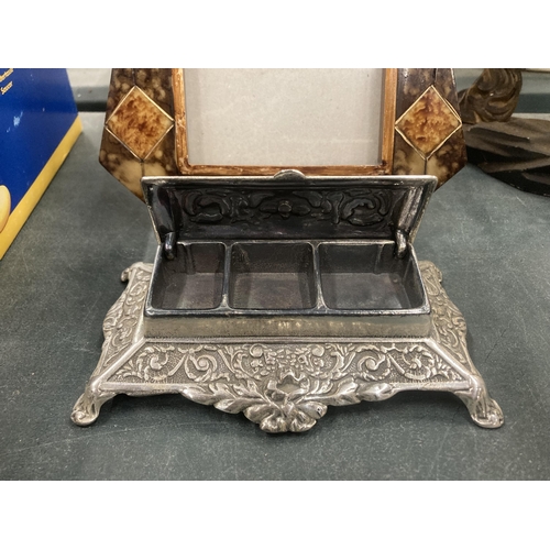 195 - AN ORNATE PHOTO FRAME AND A SILVER PLATED STAMP HOLDER