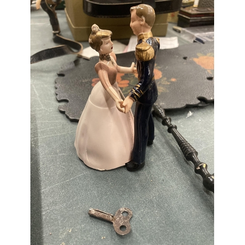 208 - A CLOCKWORK PRINCE AND PRINCESS TOY 13CM