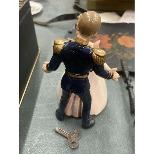 208 - A CLOCKWORK PRINCE AND PRINCESS TOY 13CM