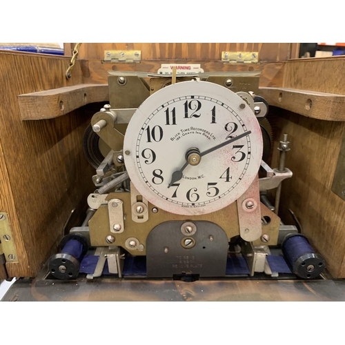 263 - A VINTAGE 'BLICK TIME RECORDERS' CLOCKING IN CLOCK IN A MAHOGANY CASE