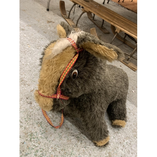 1197 - A LARGE SOFT TOY DONKEY WITH REINS