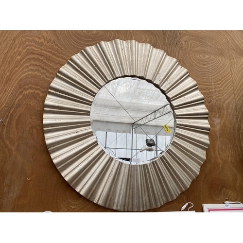 1265A - A LARGE CIRCULAR SILVER GILT FRAMED BEVELED EDGE WALL MIRROR