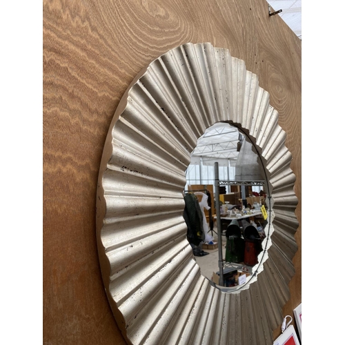 1265A - A LARGE CIRCULAR SILVER GILT FRAMED BEVELED EDGE WALL MIRROR