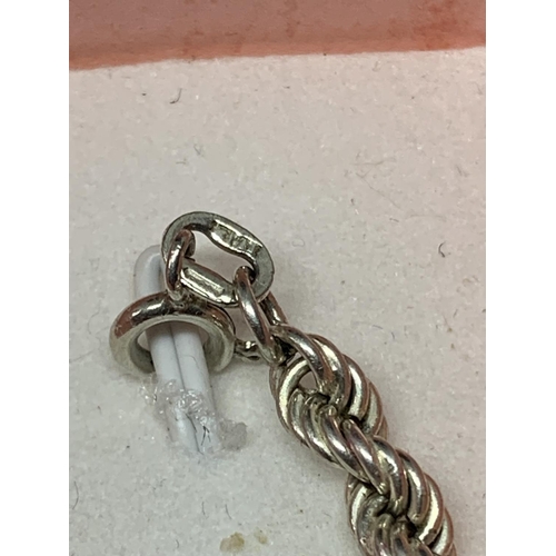 548 - A SILVER ROPE BRACELET IN A PRESENTATION BOX