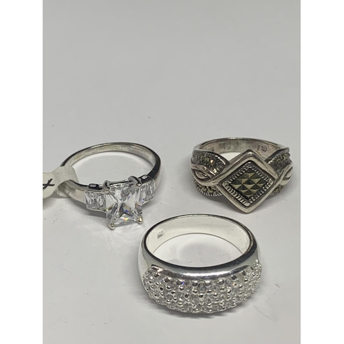 571 - FIVE VARIOUS SILVER RINGS