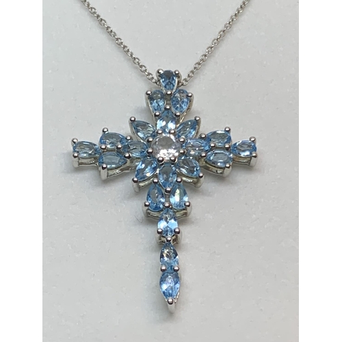 584 - A SILVER NECKLACE WITH A BLUESTONE CROSS IN A PRESENTATION BOX