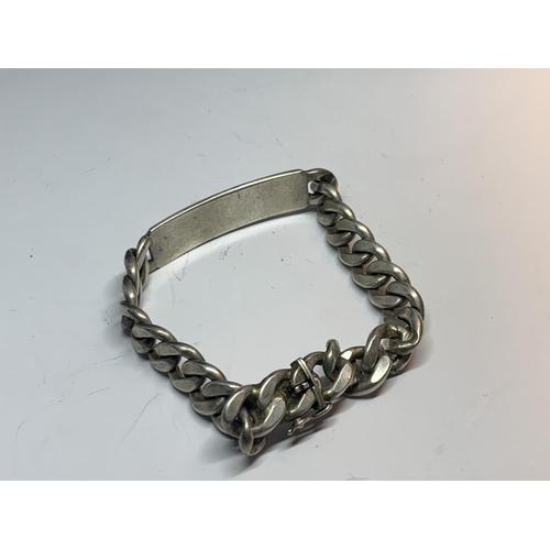 597 - A HEAVY SILVER FLAT LINK IDENTITY BRACELET