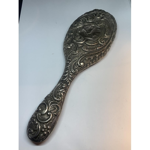 606 - A HALLMARKED CHESTER SILVER HAND MIRROR