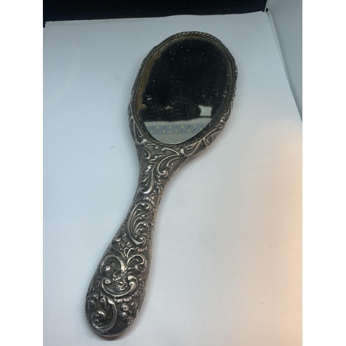 606 - A HALLMARKED CHESTER SILVER HAND MIRROR