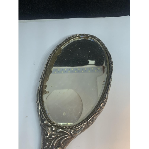 606 - A HALLMARKED CHESTER SILVER HAND MIRROR