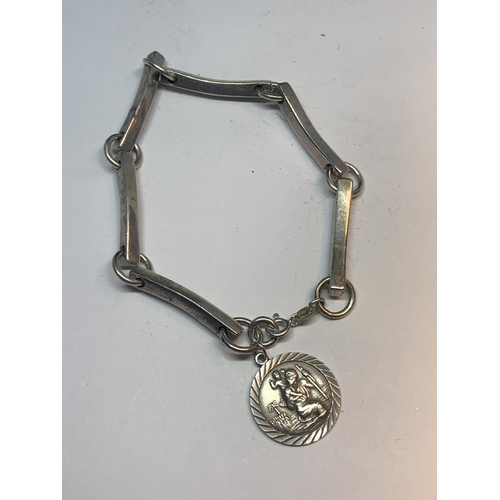 614 - A SILVER BRACELET WITH ST CHRISTOPHER CHARM