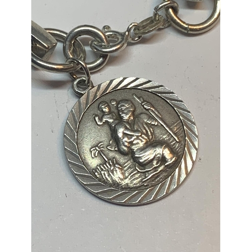 614 - A SILVER BRACELET WITH ST CHRISTOPHER CHARM