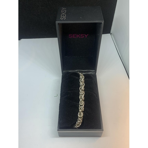 619 - A SEKSY SILVER BRACELET IN A PRESENTATION BOX