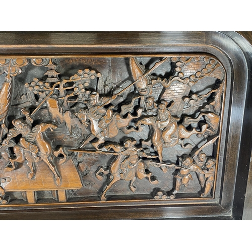 429 - A LARGE HEAVILY CARVED ORIENTAL PLAQUE DEPICTING WARRIOR DESIGN, 91 X 46CM