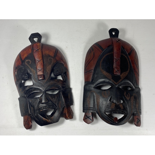 432 - A PAIR OF VINTAGE AFRICAN TRIBAL MASKS, LENGTH 23CM