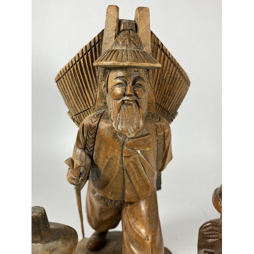 433 - A COLLECTION OF CHINESE CARVED WOODEN FIGURES TO INCLUDE A FISHERMAN