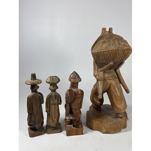 433 - A COLLECTION OF CHINESE CARVED WOODEN FIGURES TO INCLUDE A FISHERMAN