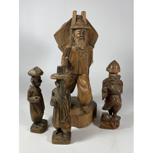 433 - A COLLECTION OF CHINESE CARVED WOODEN FIGURES TO INCLUDE A FISHERMAN