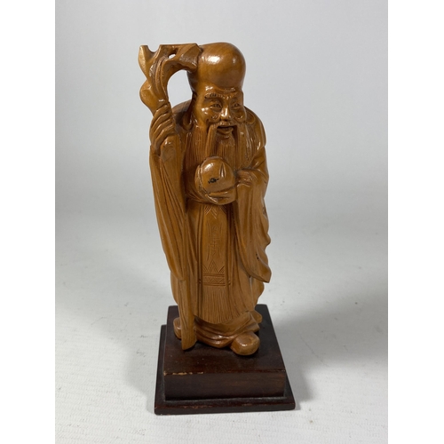 434 - A VINTAGE CHINESE CARVED WOODEN FIGURE OF AN IMMORTAL