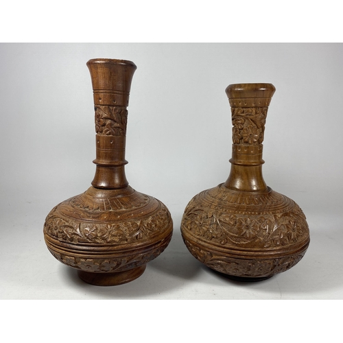 436 - A PAIR OF VINTAGE CARVED MIDDLE EASTERN WOODEN VASES, HEIGHT 23CM