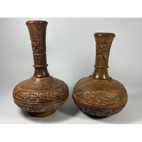 436 - A PAIR OF VINTAGE CARVED MIDDLE EASTERN WOODEN VASES, HEIGHT 23CM