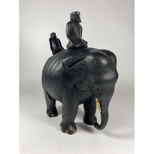 441 - A TRIBAL CARVED WOODEN ELEPHANT MODEL WITH FIGURES, HEIGHT 28CM